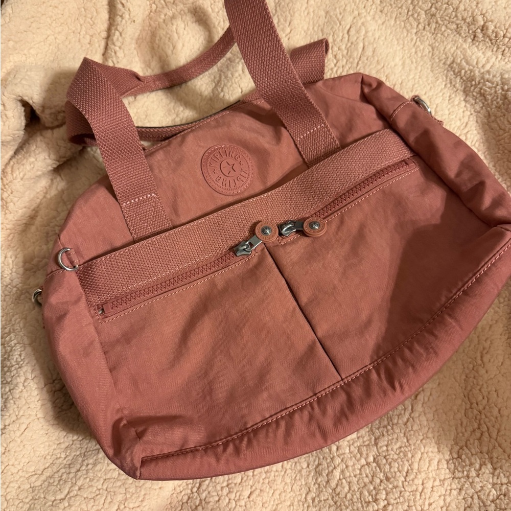 Kipling Pink Shoulder Bag with Sturdy Fabric and Oval Shape